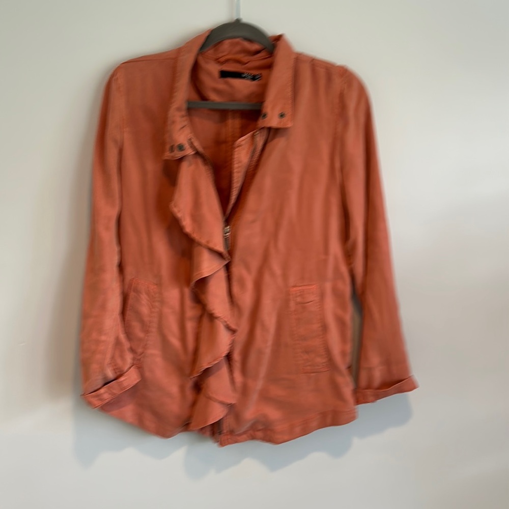 Salmon/coral colored jacket zipup with ruffle.  Perfect for fall!